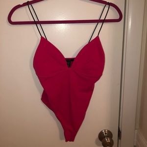 Thin strapped hot pink body suit